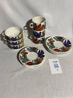Complete 12-piece set showing soup cups, saucers and mugs