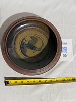 Top view showing overall glaze pattern and measuring tape for scale