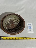 Top view showing full bowl, measuring tape for scale