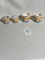 Full view of all four Miss Dainty pieces in a row