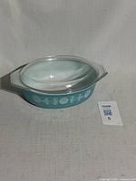 Side view of casserole with lid showing pattern and included lot tag