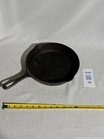 Skillet full view with tape for scale