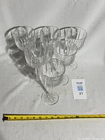 Six crystal wine goblets grouped together