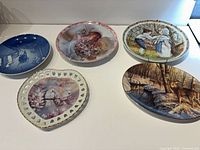 All five plates arranged on surface