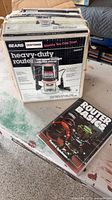 Boxed Craftsman heavy-duty router with book and accessories visible