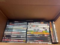 Open box showing rows of DVD spines