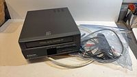 Top and front view of Emerson VCR with bagged accessories