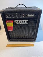 Front view of Fender Rumble 15 amplifier showing grille, logo and size reference
