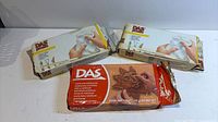 All three sealed DAS modeling clay packages in lot