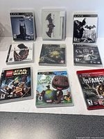 Front view of all nine PS3 game cases