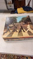 Stack of records showing top album Abbey Road