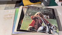 Stack of records topped by Janis Joplin's Greatest Hits