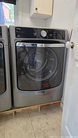 Closed view of Maytag Maxima metallic slate front-load gas dryer