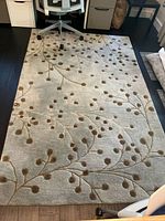 Full view of rug in room, showing overall pattern and size