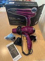 Hair dryer with cord, two attachments (one bagged), manual, original box