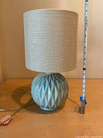 Full view of lamp with tape showing height