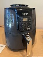 Front view showing Ninja branding, control panel and handle