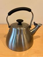 Front view of stainless steel OXO kettle showing handle, lid and spout