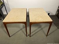 Top view of both Beaucraft side tables showing marble surfaces and walnut frames