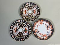 All three Royal Crown Derby plates front view