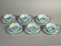 Full set of six matching teacups and saucers displayed