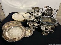 Group shot of entire lot including chargers, trays, tea service pieces, bowl