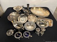 All pieces grouped showing variety of silver plated serve ware