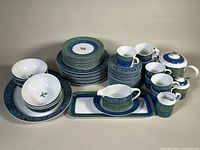 Full view of entire 53-piece dinnerware set showing pattern and counts