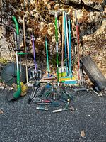 Group shot displaying trimmer, long-handled tools, hand tools and step stool