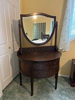 dresser with attached mirror
