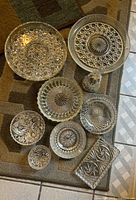 Group shot of all nine cut crystal pieces on floor