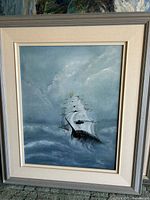 Front view of ship painting in frame