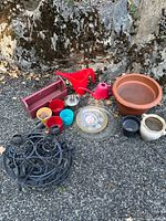 Group shot showing all pots, planter, watering can, bowl, saucer and some stands