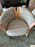 Barrel chair top view showing upholstery pattern and wood frame