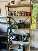 Full view of yellow metal rack with contents