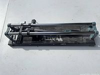 Top view of Anvil manual tile cutter showing full length and rails