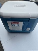 Front view of blue Coleman Chiller cooler showing label and white lid