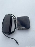 Charging pad and power adapter with barrel connector visible