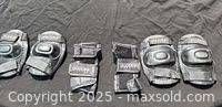 All six black protective pads laid out