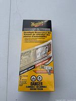 Front of Meguiar's Heavy Duty Headlight Restoration Kit box