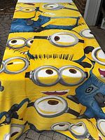 Full view of Minions print microfiber throw blanket spread out