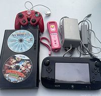 Full set including console, GamePad, two controllers, power adapter, two game discs