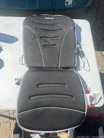 Full view of cushion laid flat on table with wiring visible