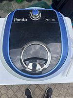 Top view showing Panda branding, control knob, clear lid