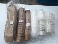 All five sealed packs: two stacks kraft bowls, two bags white lids, one stack kraft boxes