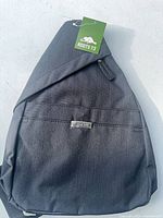 Front view showing Roots 73 tag and logo plate on pocket