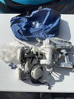 All items laid out: paint sprayer, respirator, bag, accessories