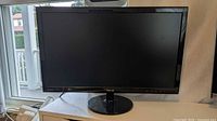 Front view of ASUS VS247 monitor powered off on stand
