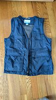Front view of navy Columbia vest showing pockets and zipper