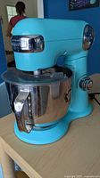 Turquoise Cuisinart stand mixer with bowl attached